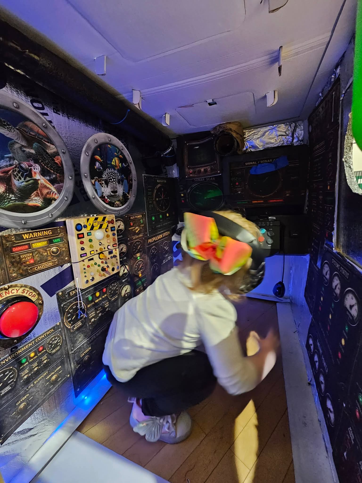 Child exploring the submarine periscope display