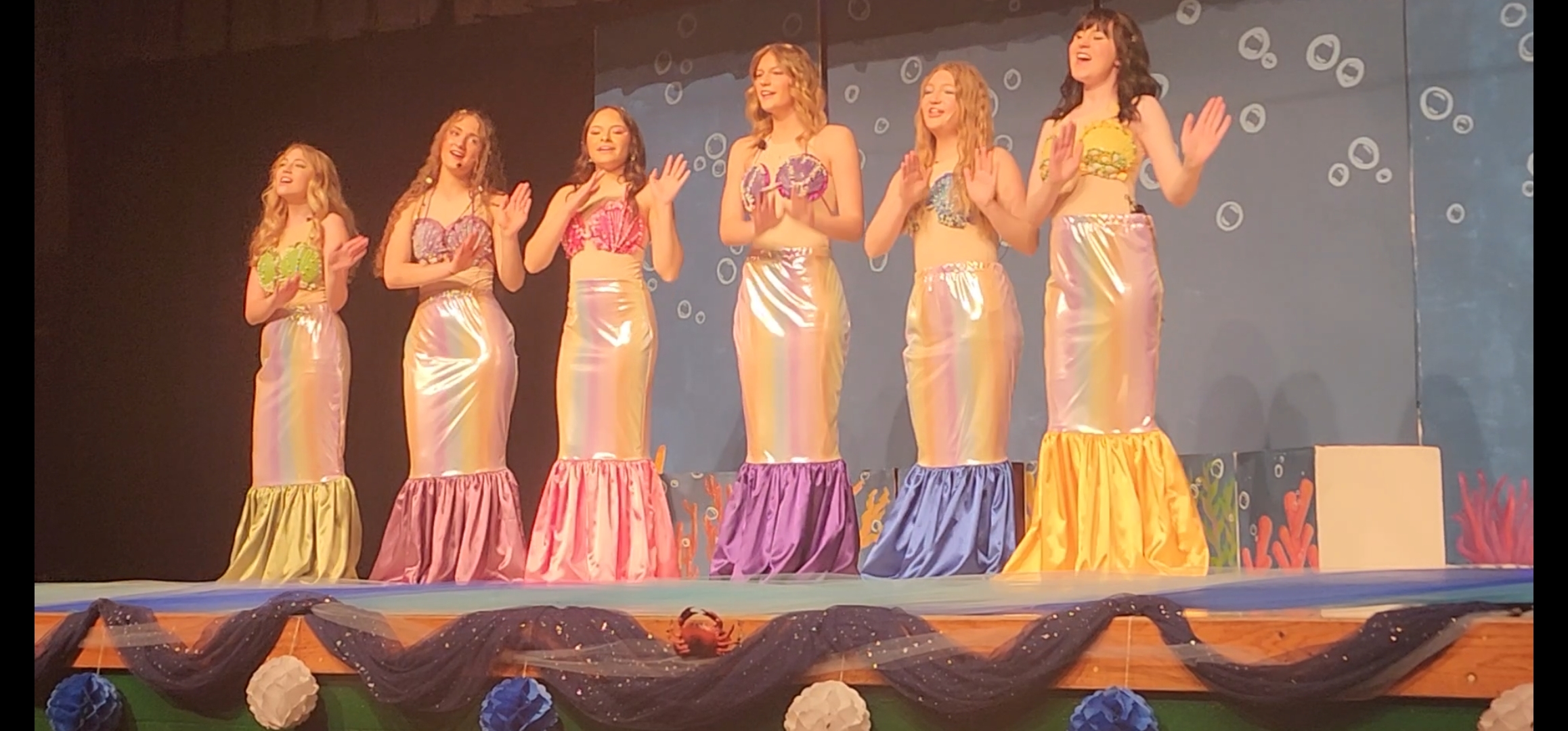 The Little Mermaid cast performing on stage